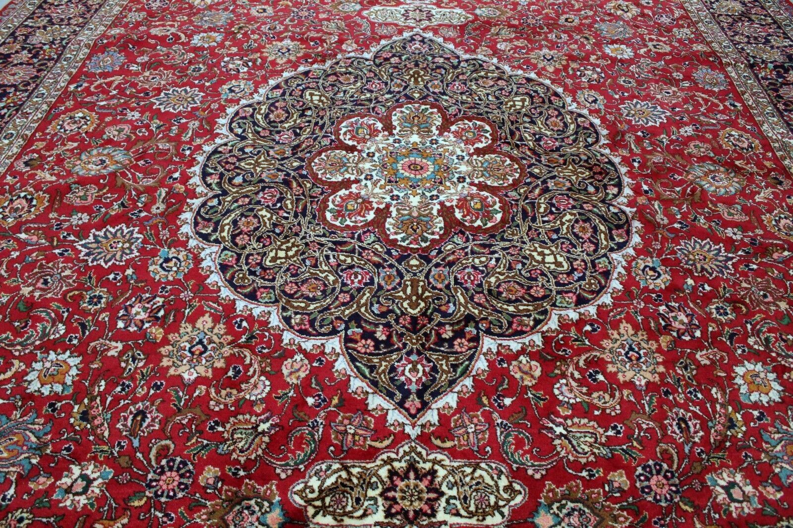 Rich Red Base Color Creating Warm and Inviting Backdrop for Elaborate Designs on Handcrafted Tabriz Rug - 1960s