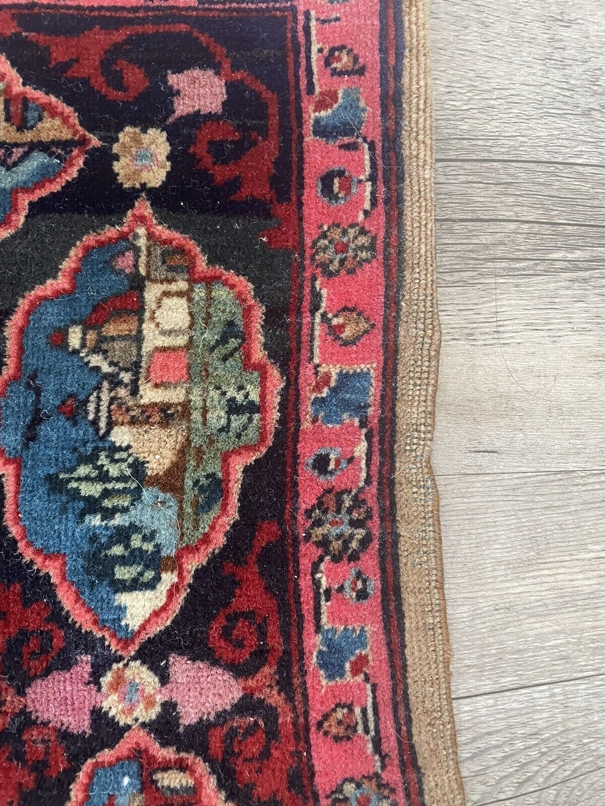 Close-up of wear on Handmade Antique Persian Kashan Collectible Rug - Detailed view showing some low pile and wear over time, indicating the rug's age and history.