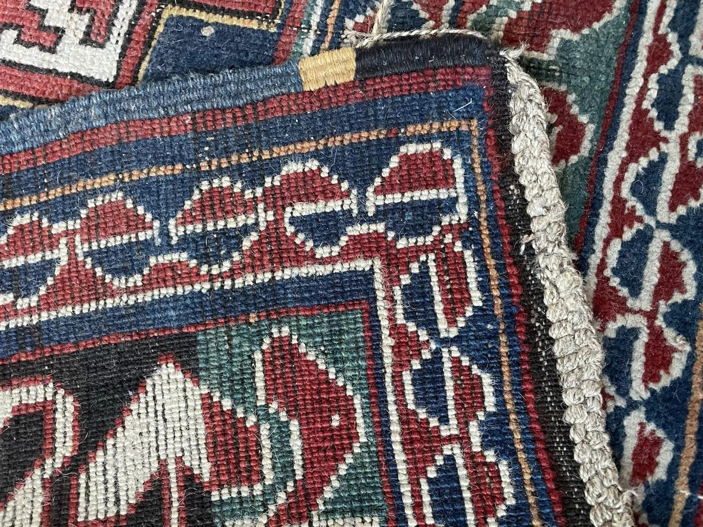 Detail of the main border with its classic "running dog" pattern.