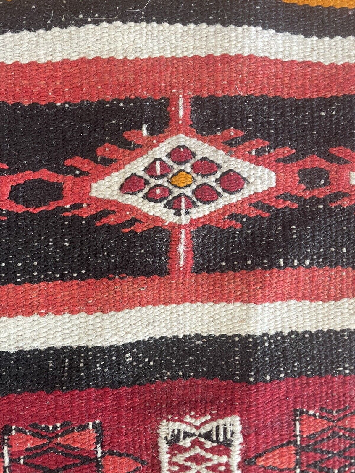 Close-up of fringes on Handmade Antique Moroccan Berber Kilim Rug - Detailed view emphasizing the fringes at the top end of the rug, indicating its handmade nature and cultural authenticity.