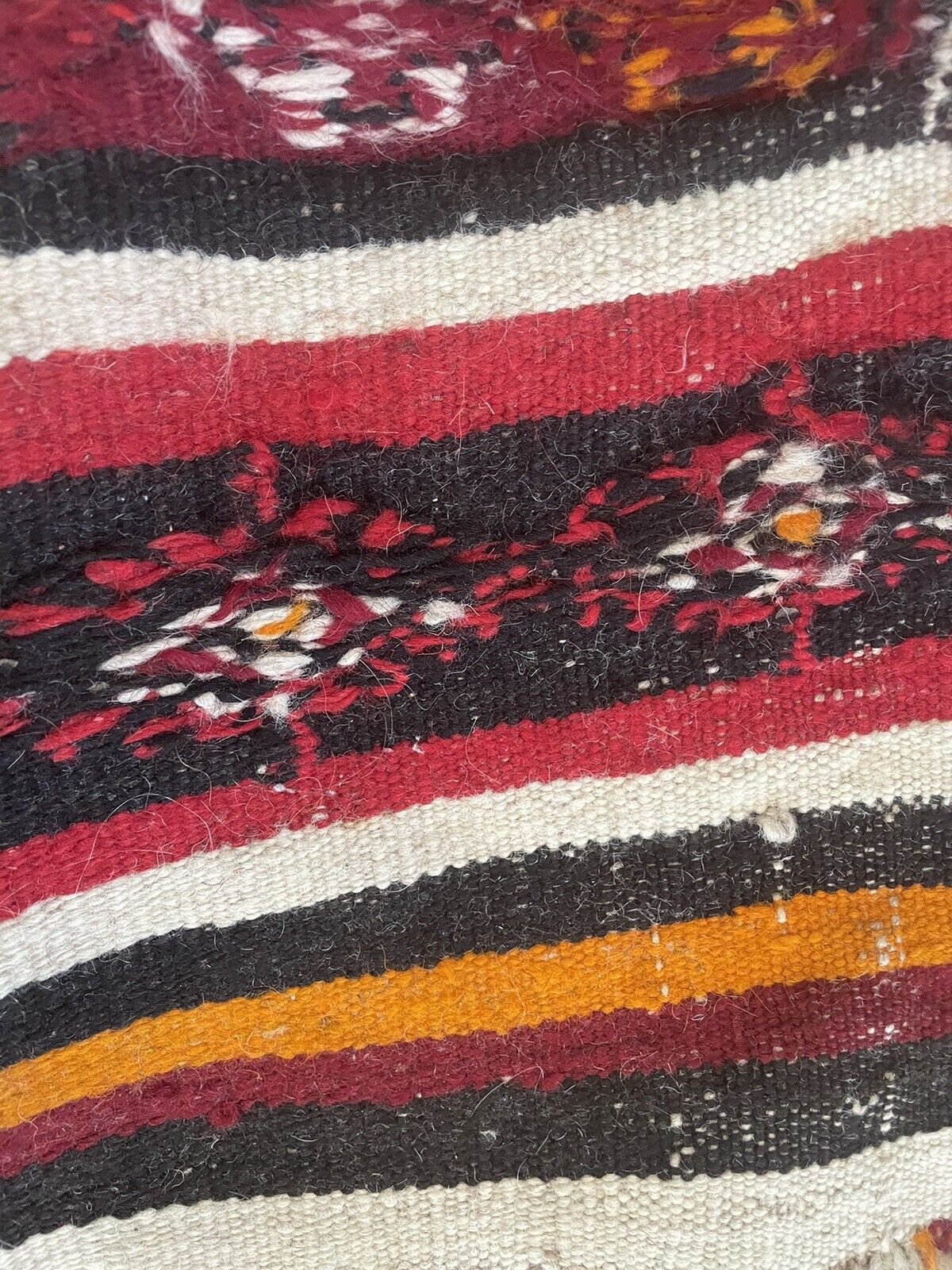 Close-up of character on Handmade Antique Moroccan Berber Kilim Rug - Detailed view showcasing the rug's character and charm, shaped by its age wear and unique design.