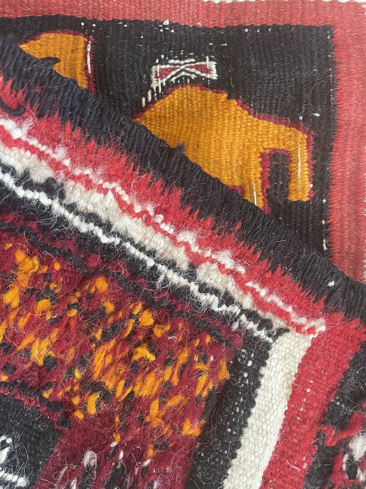 Close-up of camel motif on Handmade Antique Moroccan Berber Kilim Rug - Detailed view highlighting the central camel motif, symbolizing desert life and resilience.