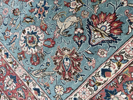 Stylized birds perched among scrolling vines