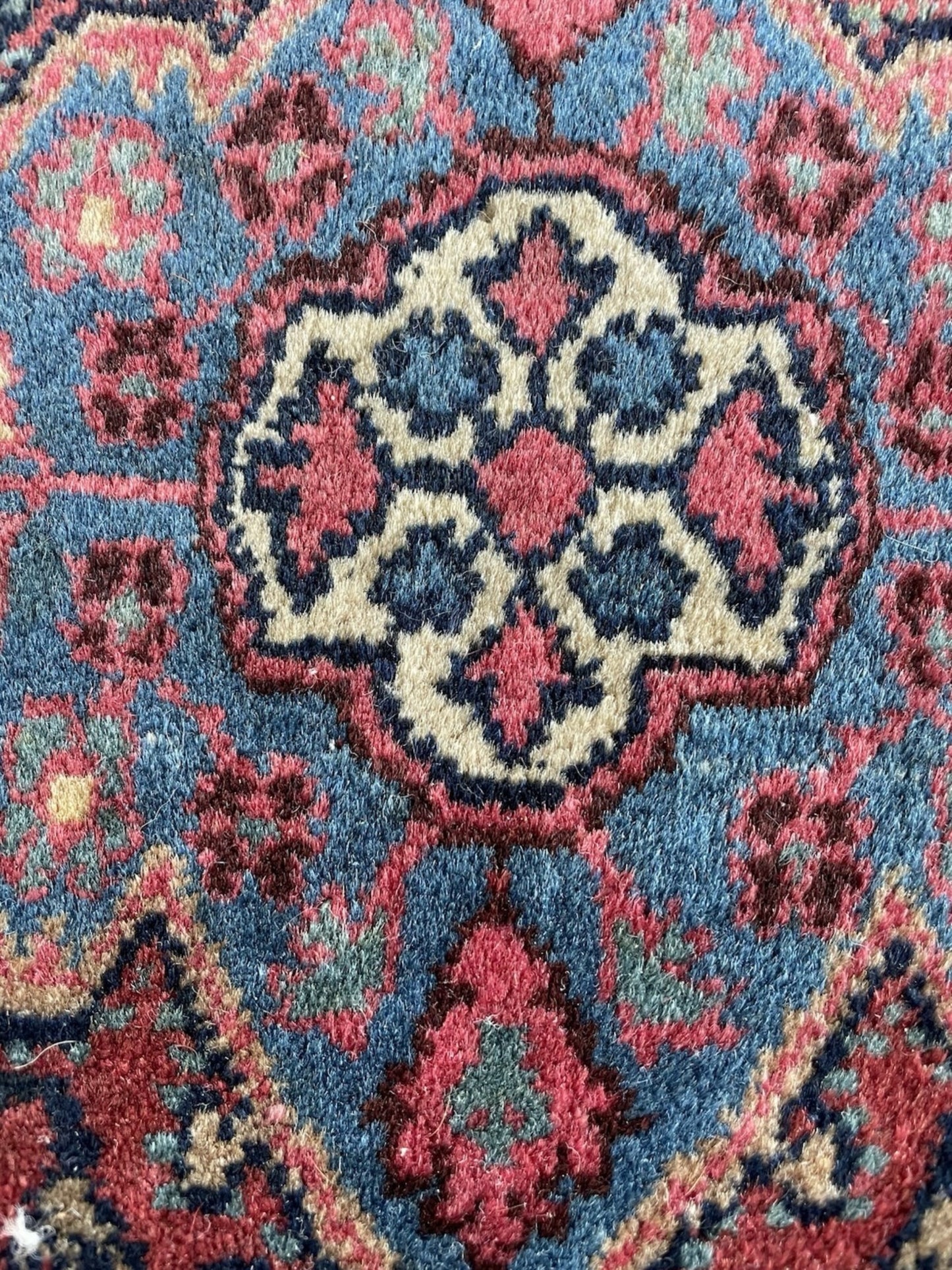 Close-up of the terracotta and cream accents within the pattern.