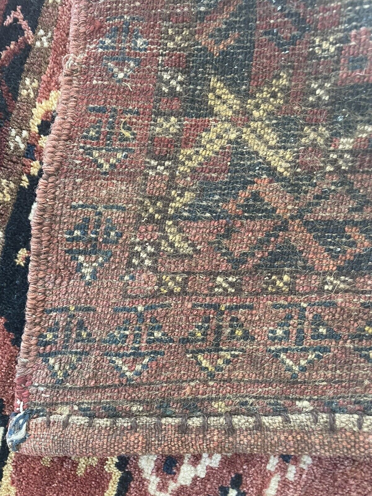 Close-up of cultural heritage on Handmade Antique Afghan Beshir Collectible Chuval Rug - Detailed view showcasing the rug's cultural heritage and connection to Afghanistan, evident in its distinct style and craftsmanship.