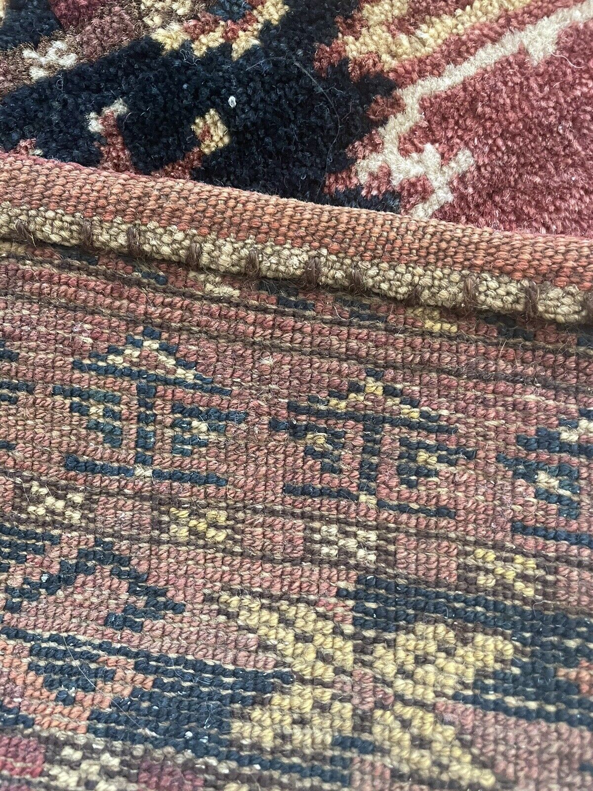 Back side of the Handmade Antique Afghan Beshir Collectible Chuval Rug - Underside view revealing the rug's construction and material.