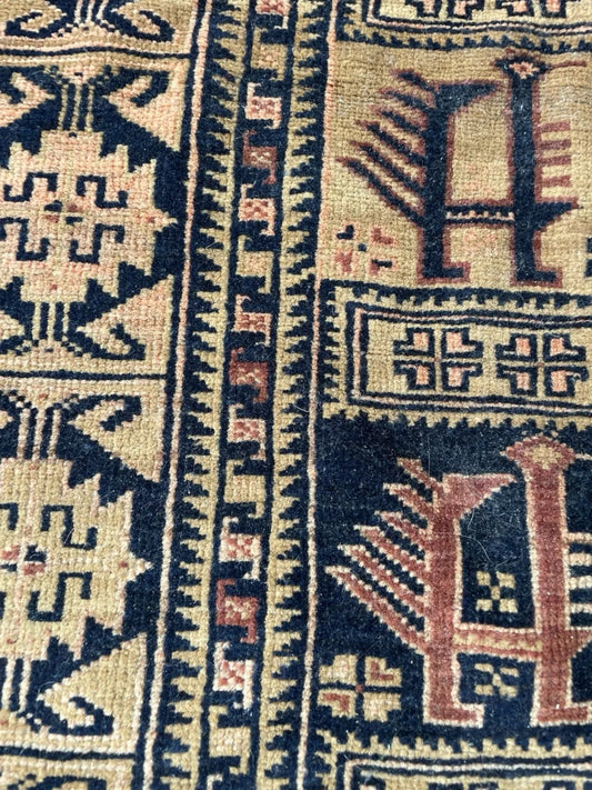 Afghan Baluch rug border detail featuring geometric patterns and authentic 1920s tribal weaving techniques