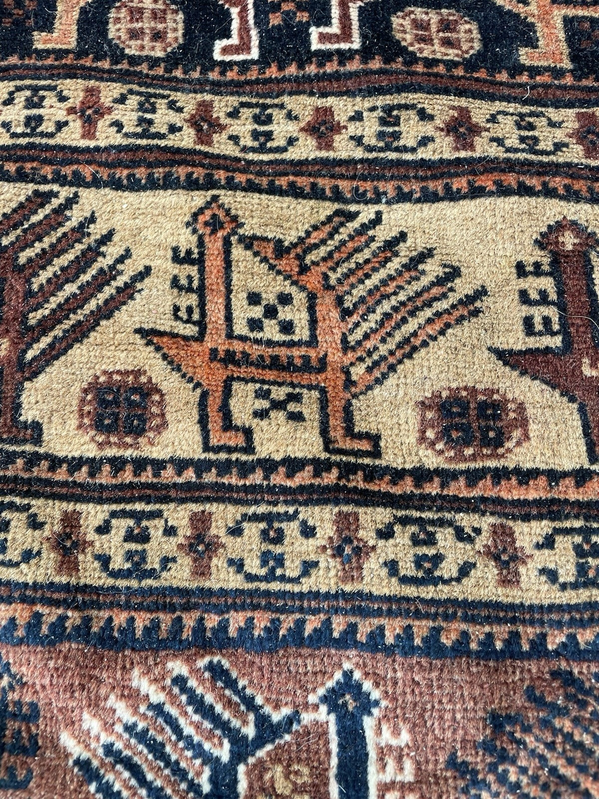 Circa 1920s handmade Afghan rug with a low-to-medium wool pile, authentic signs of use, and collectible early-century character.
