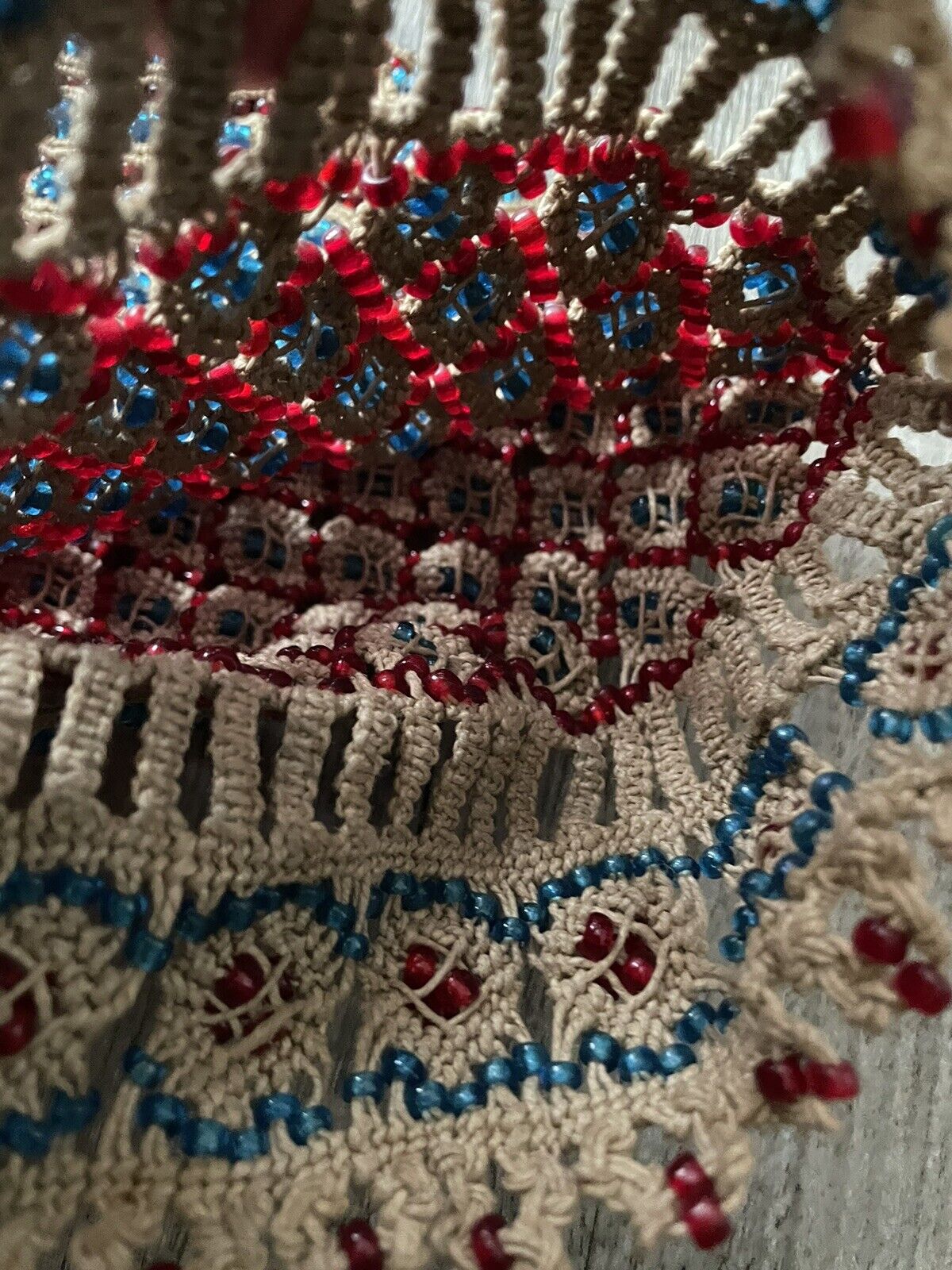 The handmade vintage Malian bag (1960s) displayed alongside other vintage accessories, emphasizing its place within the history of fashion and cultural exchange.