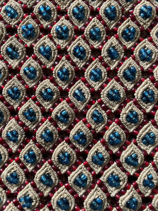 Close-up of the intricate diamond-shaped beadwork on the handmade vintage Malian bag (1960s), emphasizing the vibrant colors and traditional Malian design.