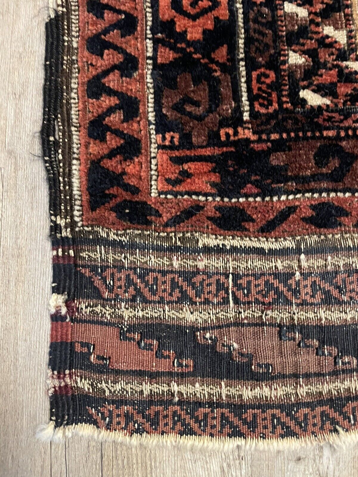 A lifestyle image featuring the rug placed in a living room setting with comfortable seating, creating a warm and inviting atmosphere.