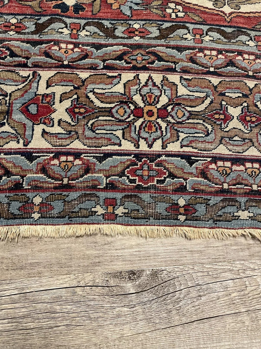 Vintage Kerman Lavar rug with intricate floral and geometric patterns