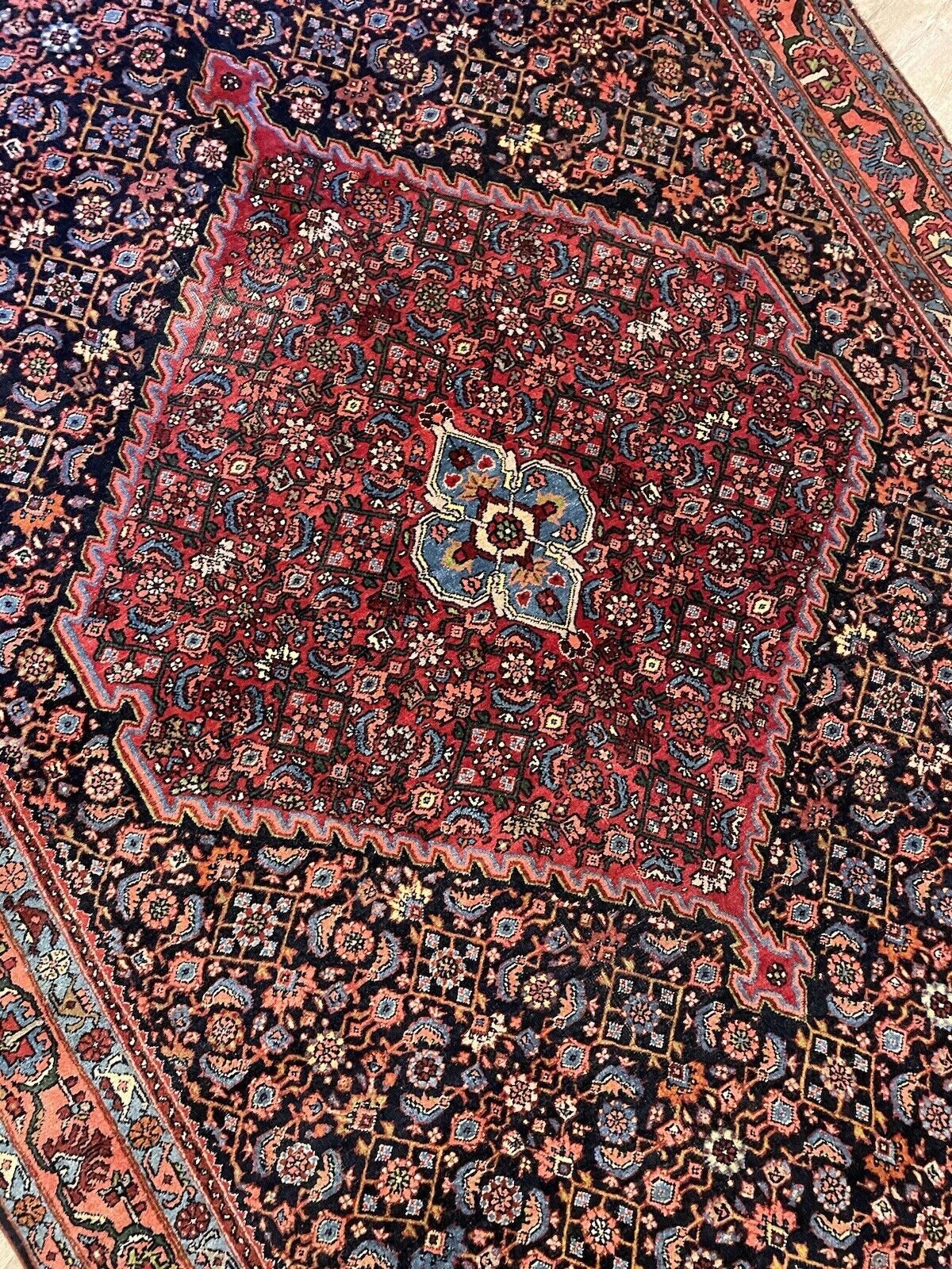Dense and tightly woven structure of an antique Bidjar wool rug