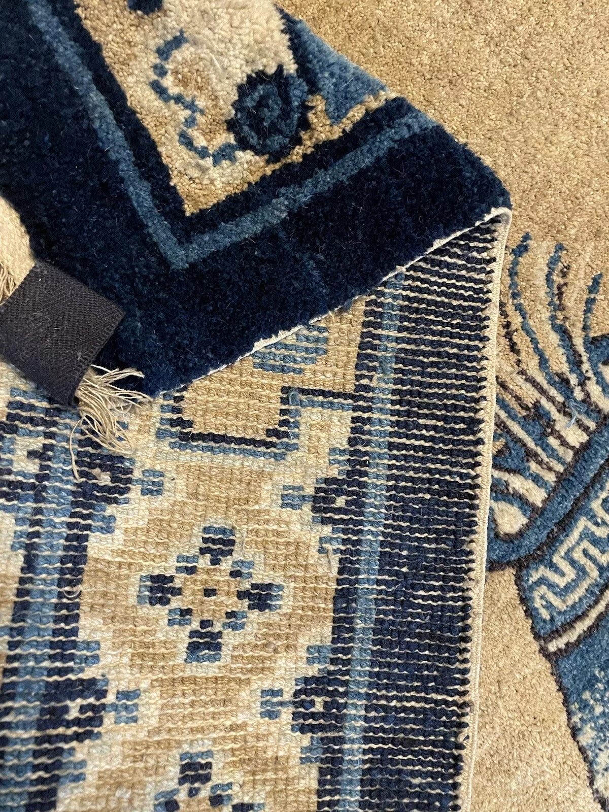Handwoven antique Peking carpet with fine craftsmanship