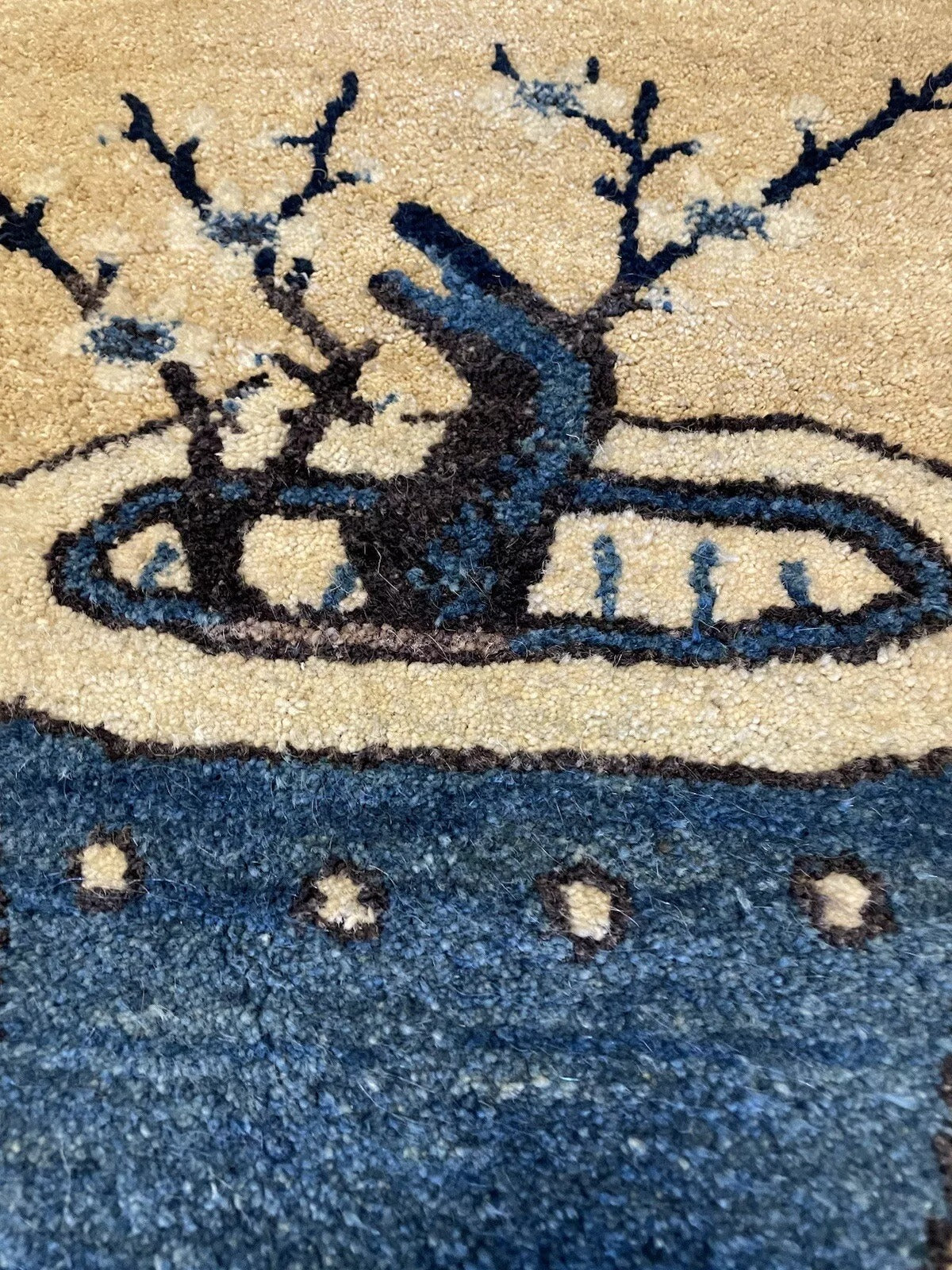 Soft and finely woven structure of an antique Peking wool rug