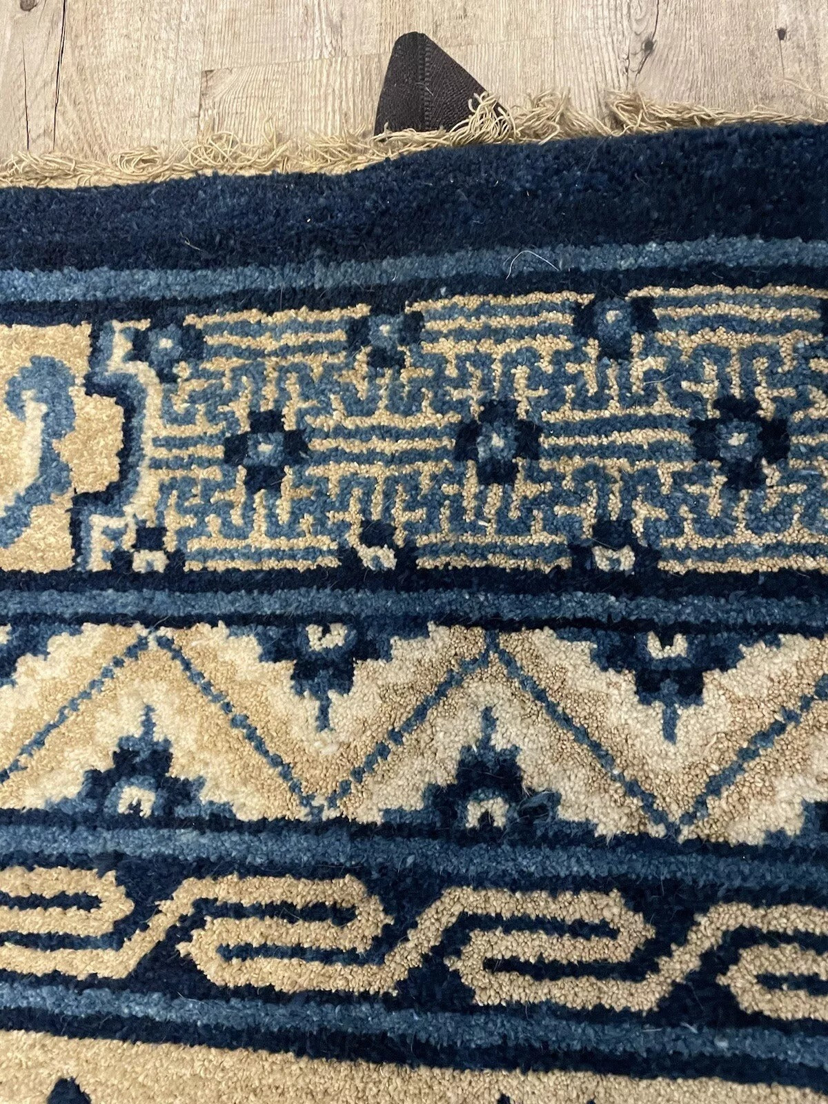 Classic floral and geometric details on a well-preserved Peking rug