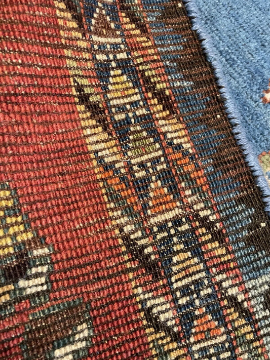 Close-up of central lion motif on an antique Gabbeh rug
