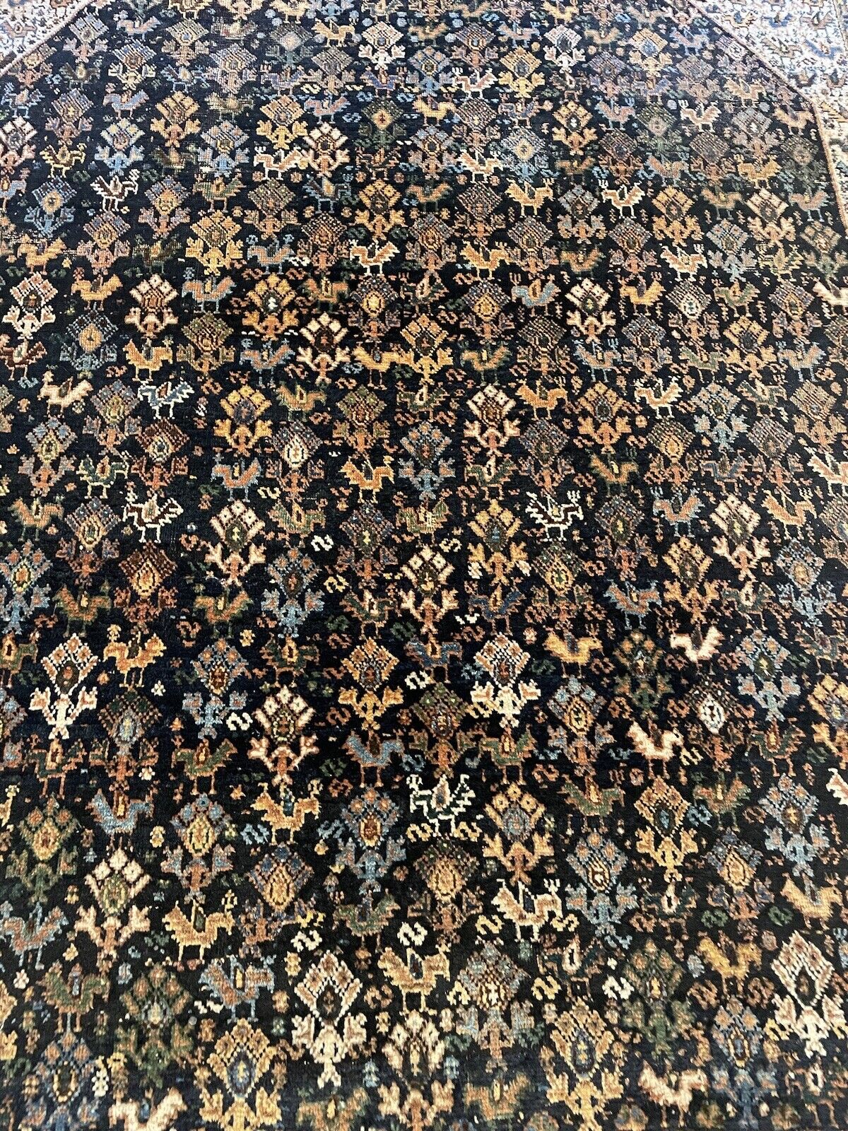 Aged but well-preserved handmade tribal wool rug