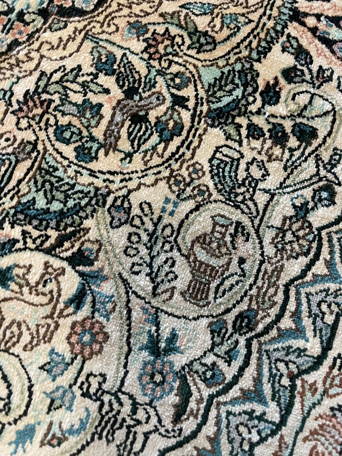 Aged but well-preserved hand-knotted silk rug