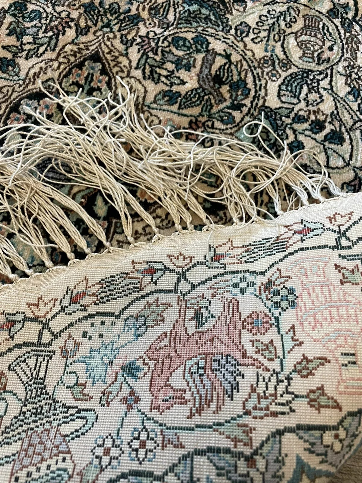 Classic floral and geometric design on a high-quality silk rug