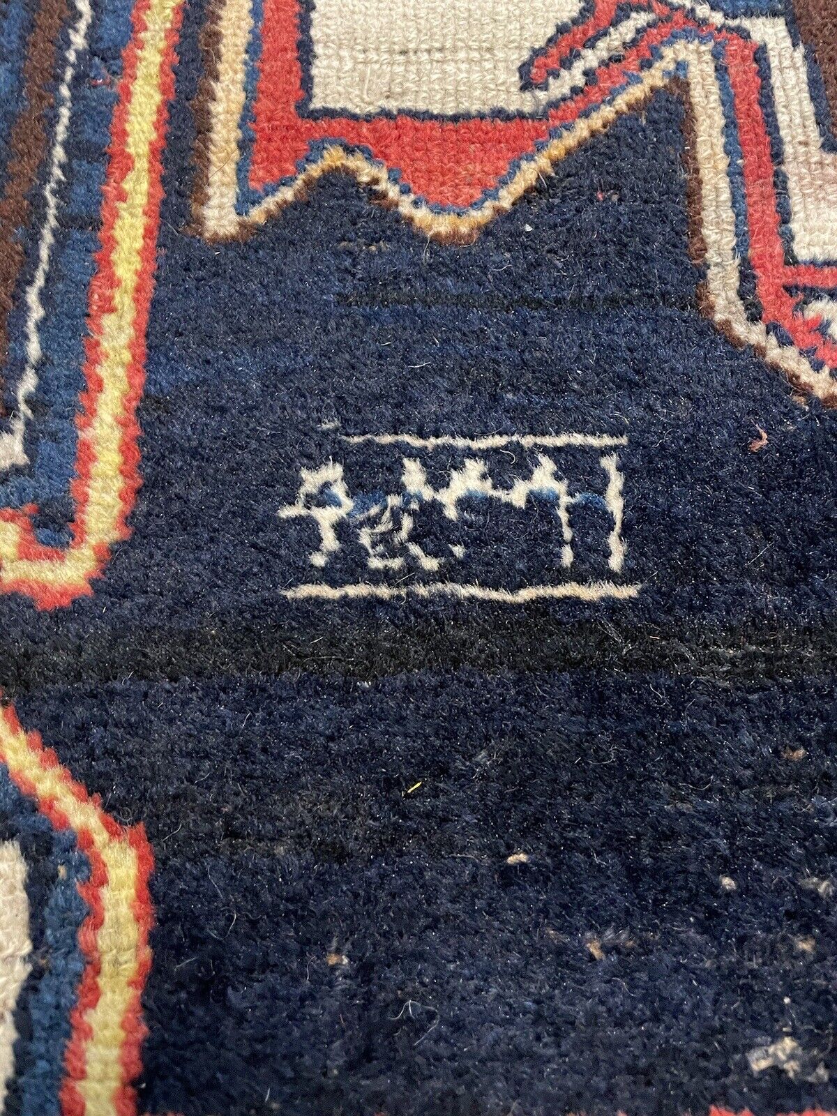 Richly colored vintage wool rug with floral and geometric patterns