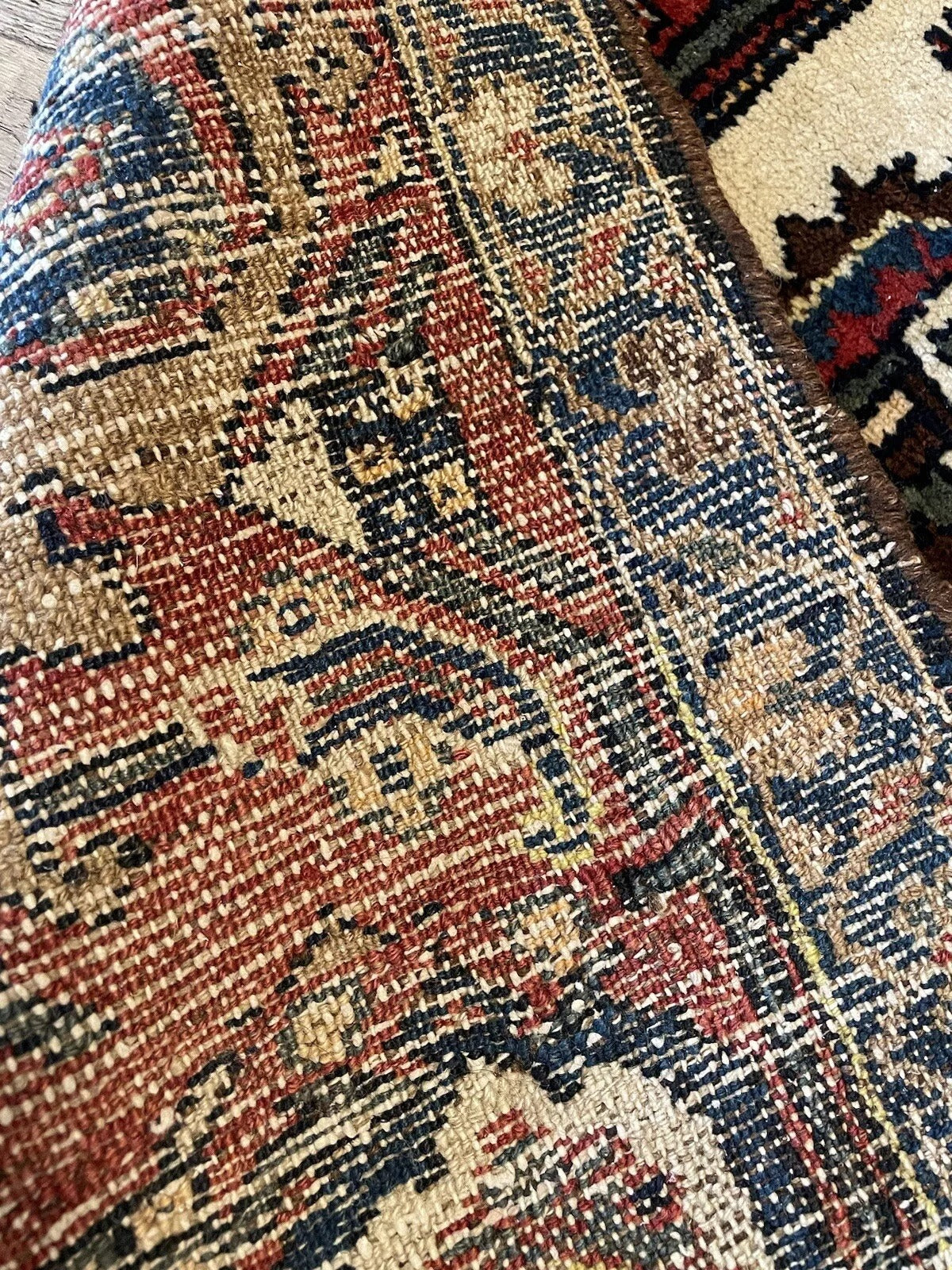 Authentic antique rug with traditional weaving techniques