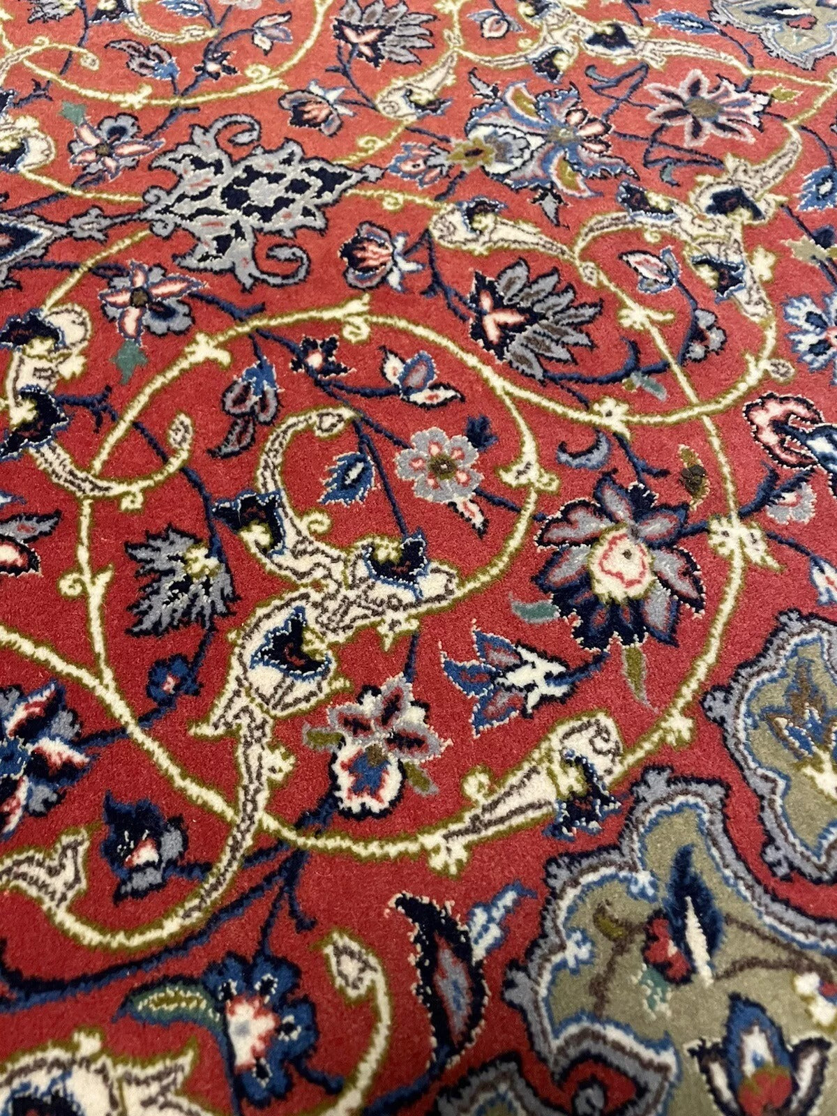 Intricate central medallion Persian rug with floral motifs