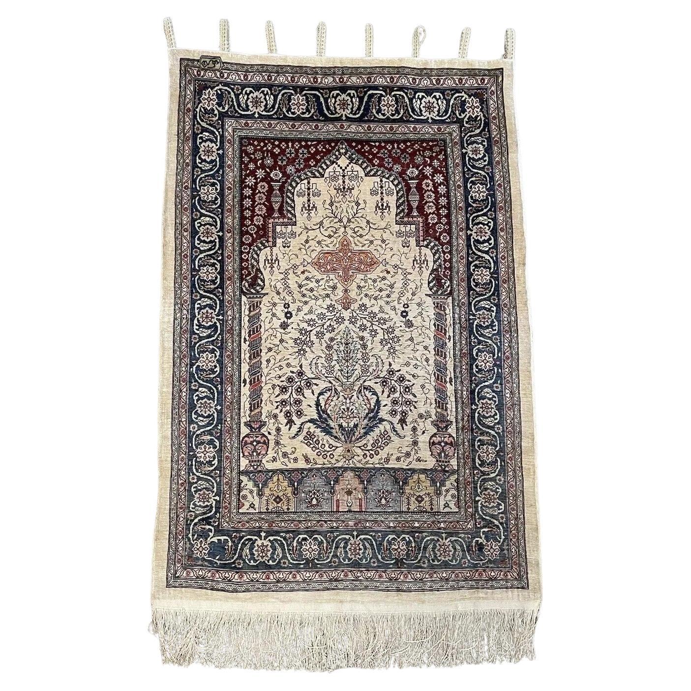 Handmade vintage Turkish Hereke silk prayer rug from the 1970s