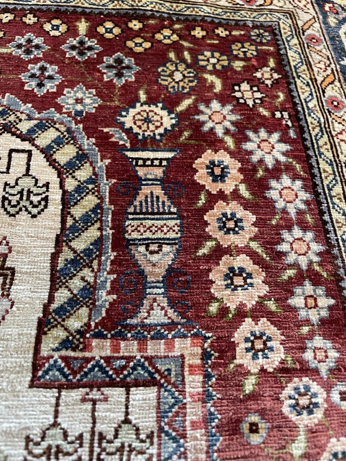 Traditional Hereke silk rug with rich colors and ornate designs