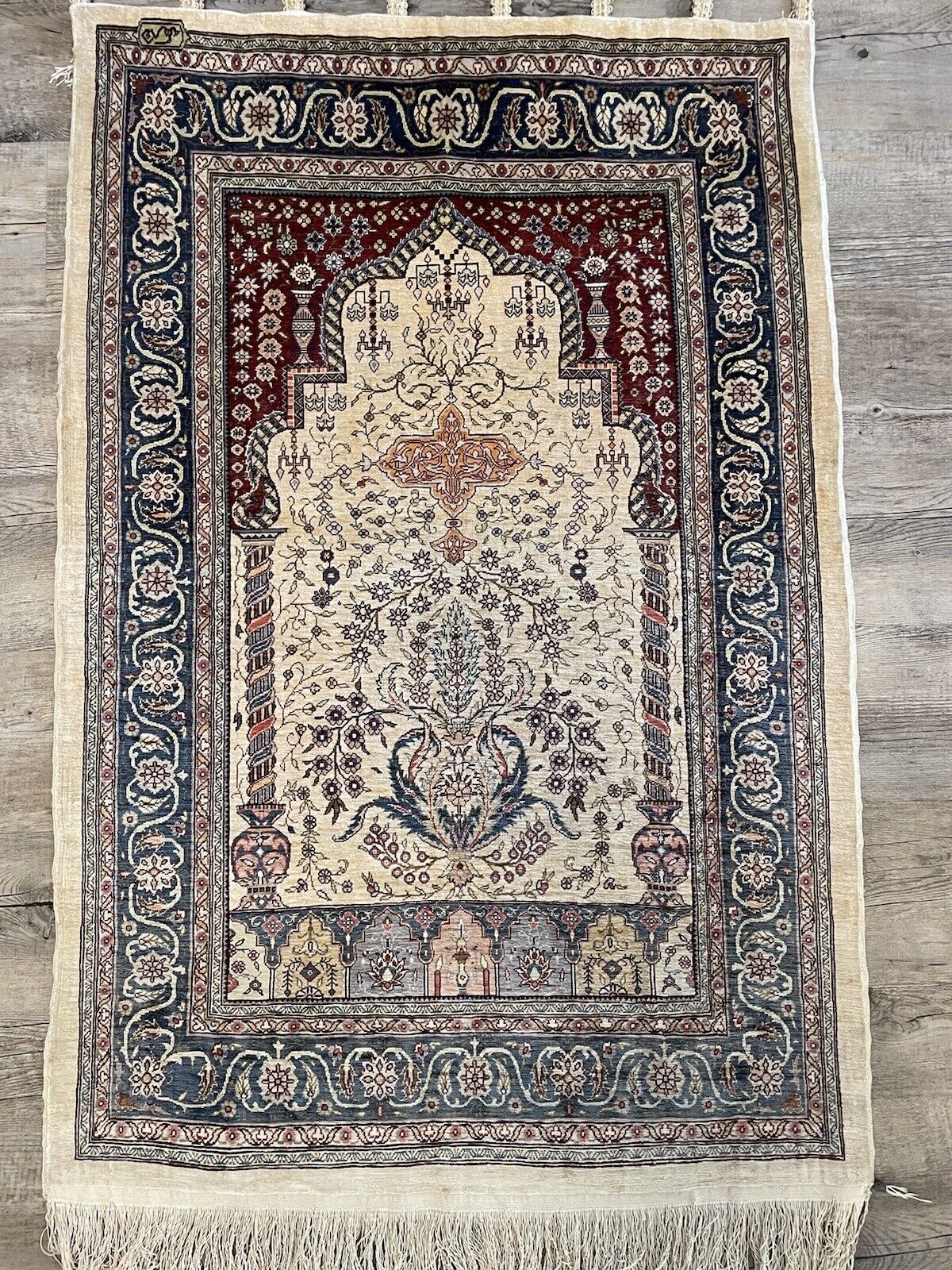 Vintage Turkish Hereke rug with traditional floral patterns