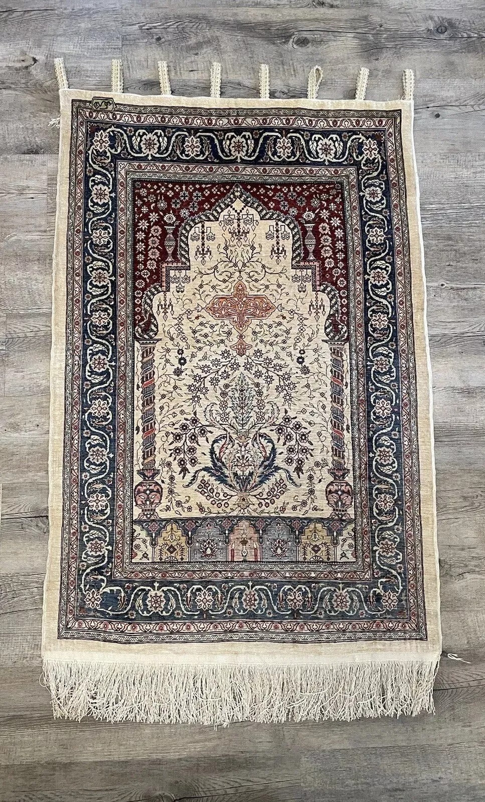 Turkish silk prayer rug with delicate floral and geometric patterns