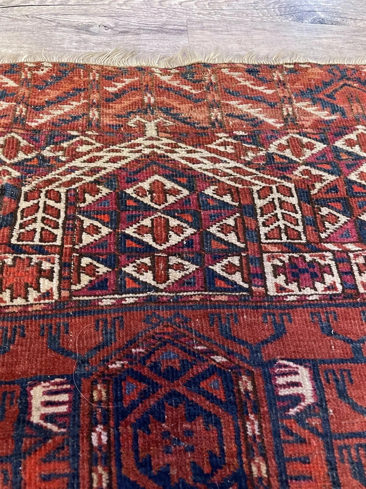 Antique Turkmen wool rug — cultural and historical significance
