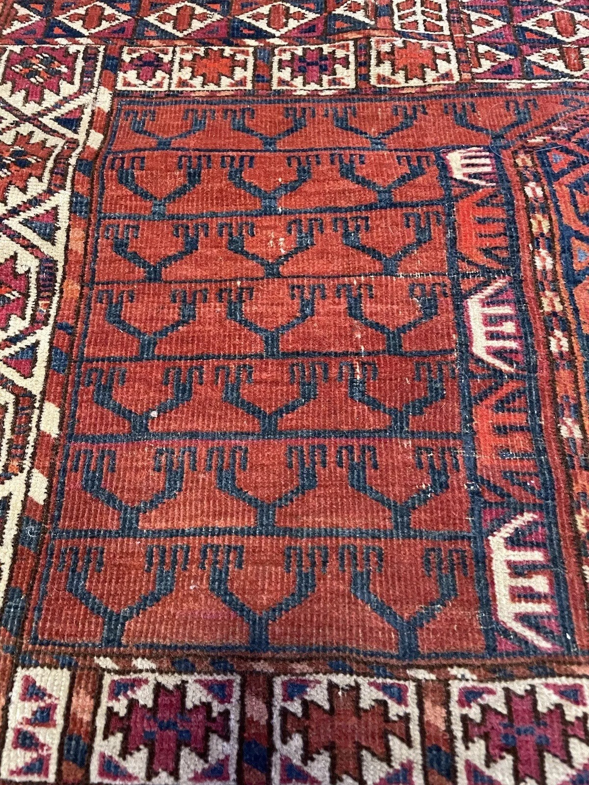 Detailed view of vintage Turkmen Engsi rug patterns