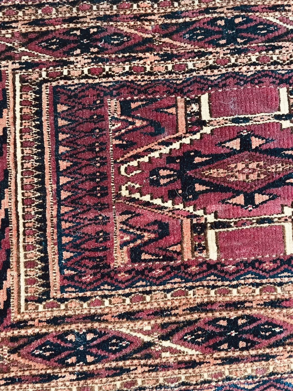 Finely woven wool texture of the antique Turkmen rug