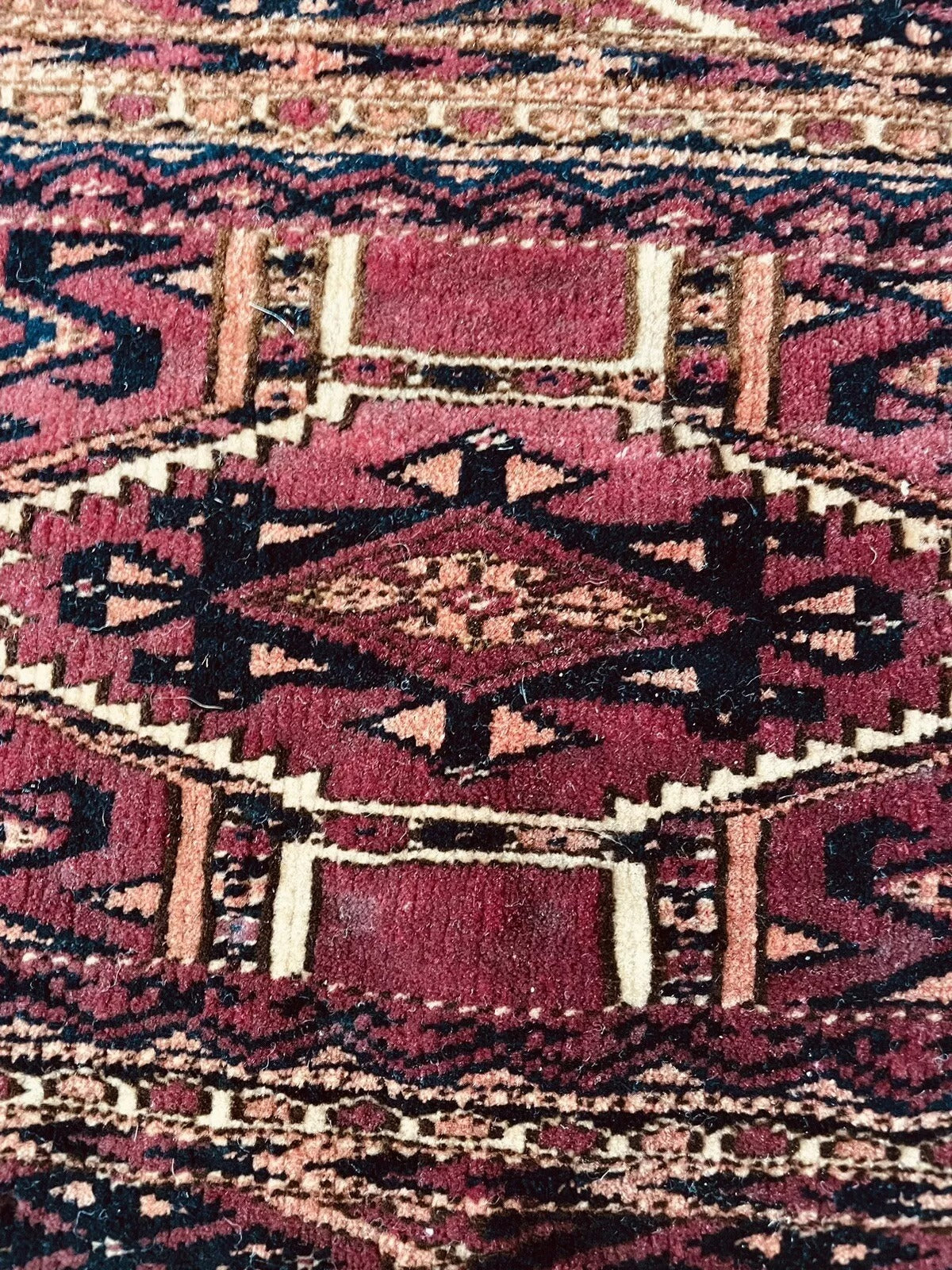 Detailed fringe of the handwoven antique tribal rug
