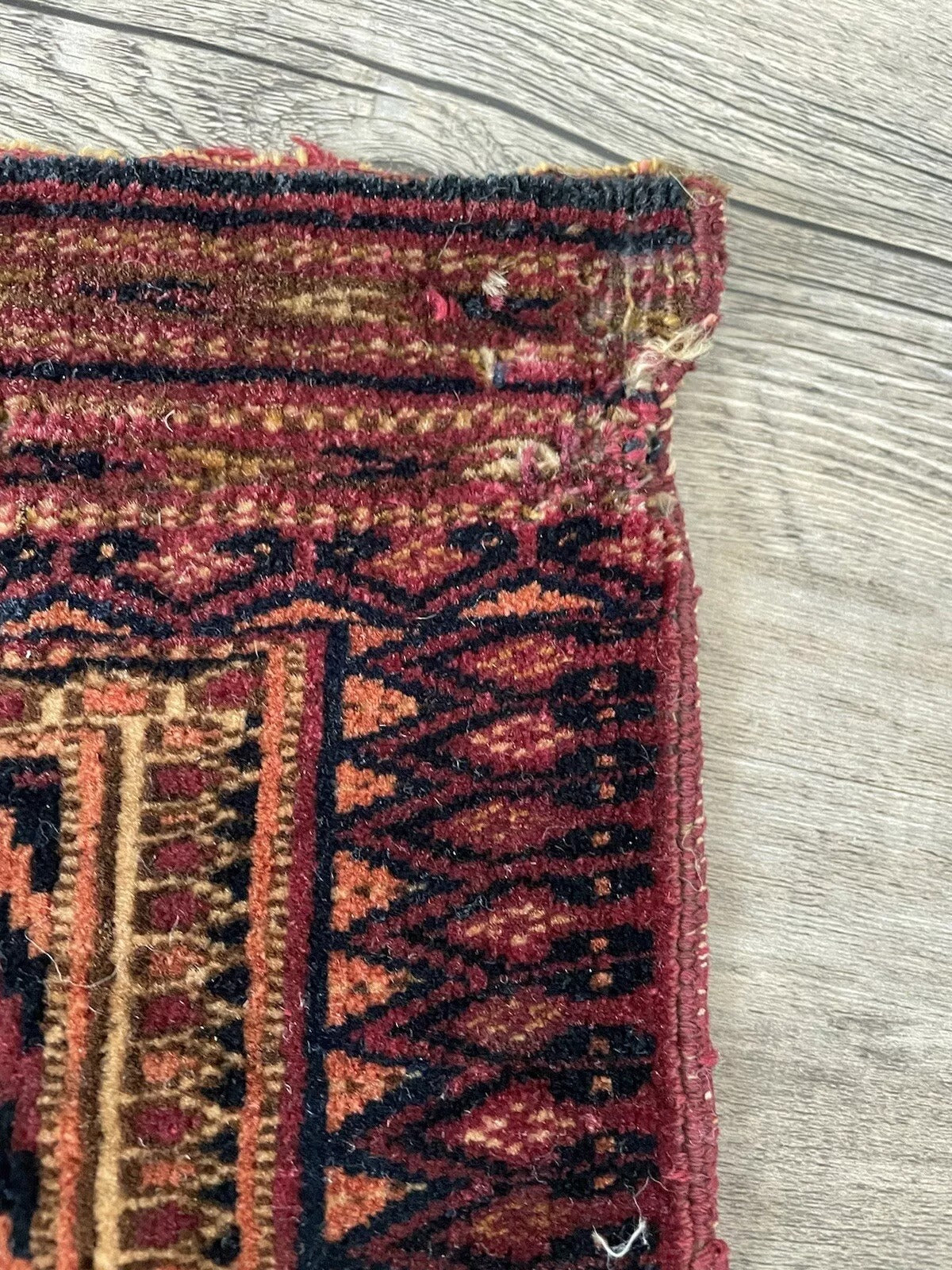 Close-up of deep earthy colors in the antique Turkmen textile