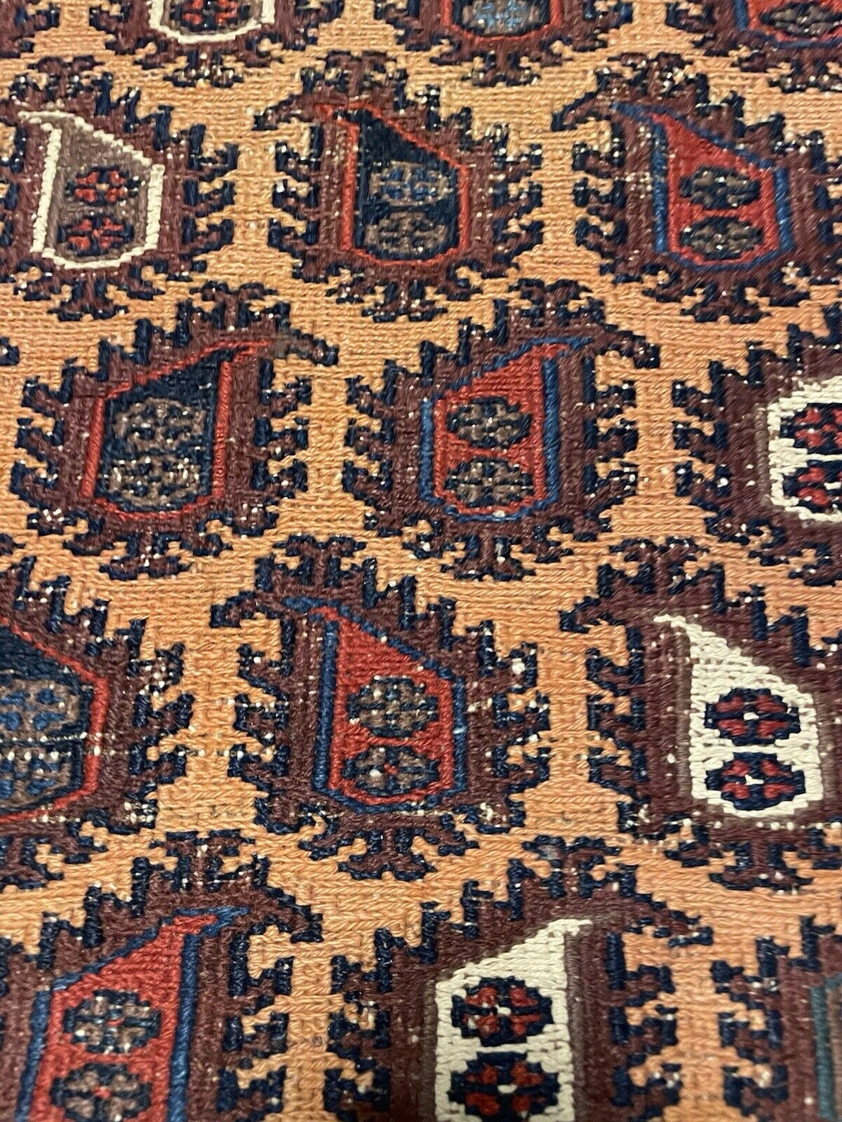 Beautiful symmetry in the geometric motifs of a handmade Afghan rug