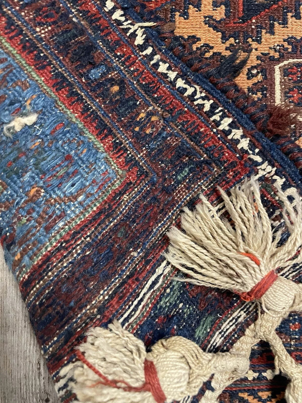 Textured wool weave of the 1920s Sumak rug showcasing skilled craftsmanship