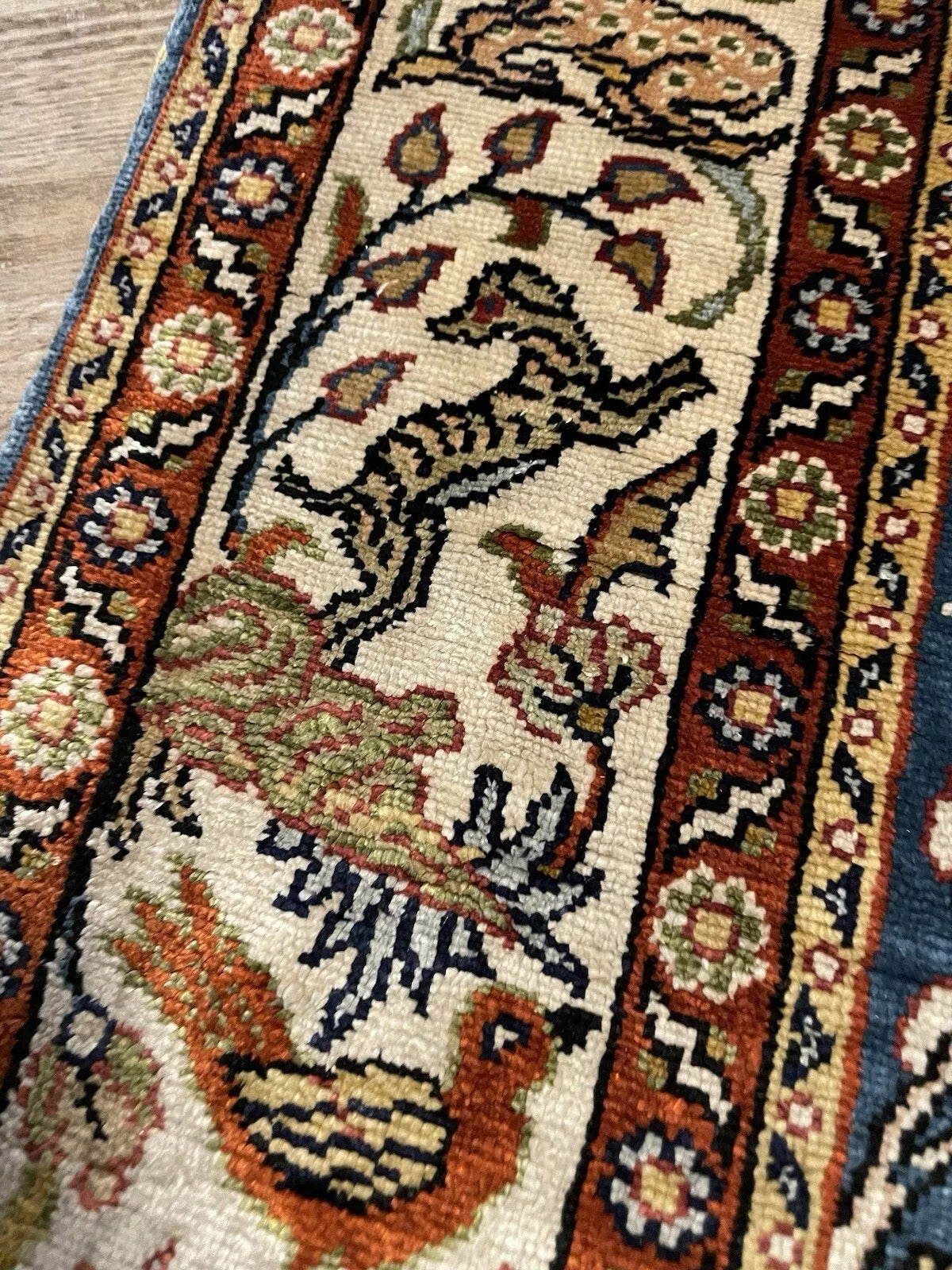 Close-up of intricate silk weave on a 1970s Hereke rug.