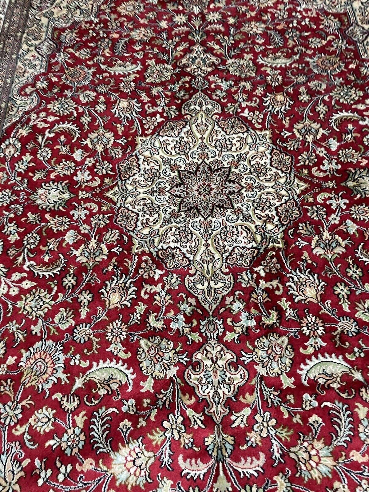 View of silk Qum rug in natural lighting