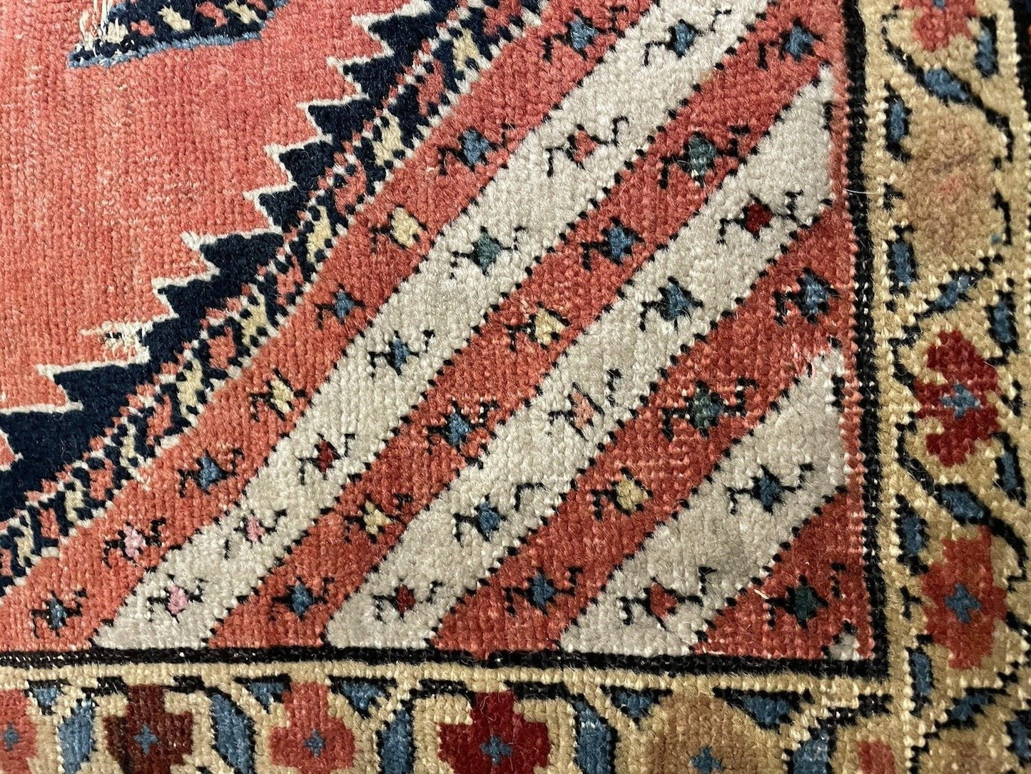 Antique Kurdish carpet with ivory border elements