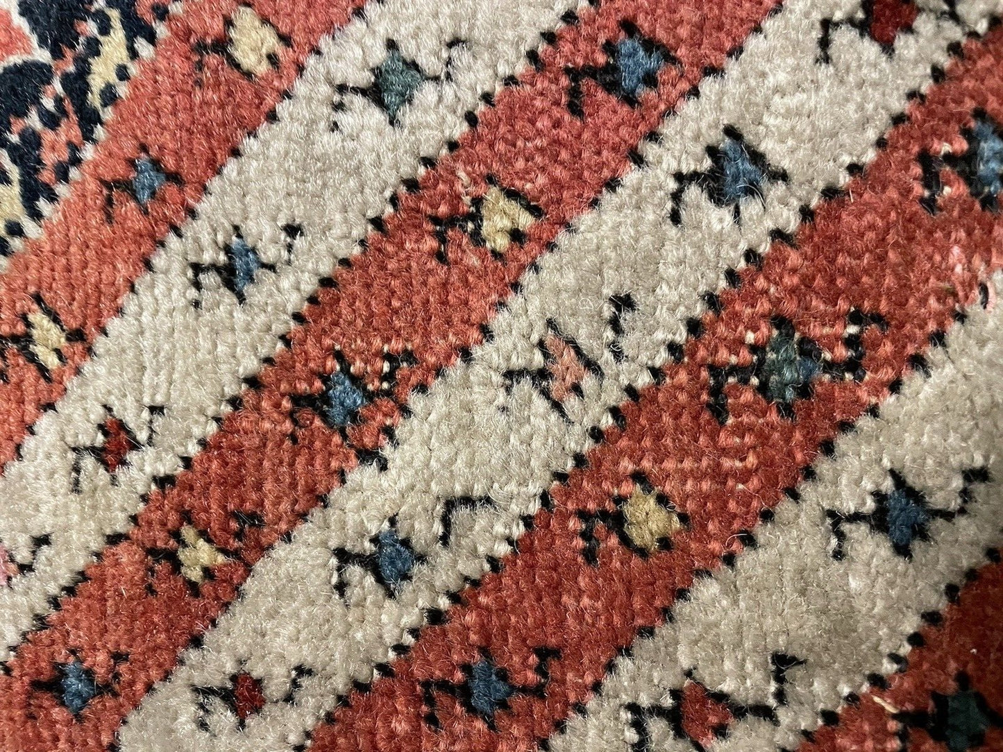 Vintage Persian rug with repeat tribal symbol layout