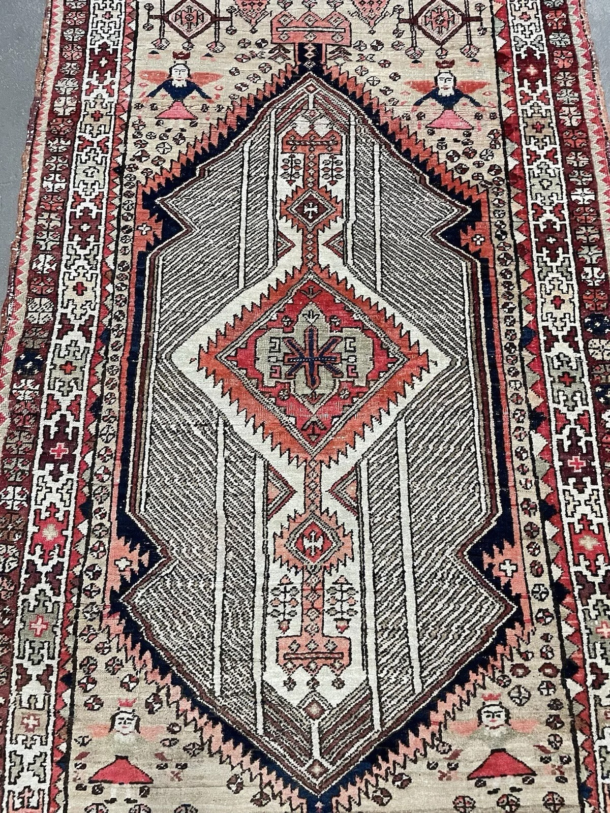Close‑up of diagonal boteh pattern on antique Seraband rug