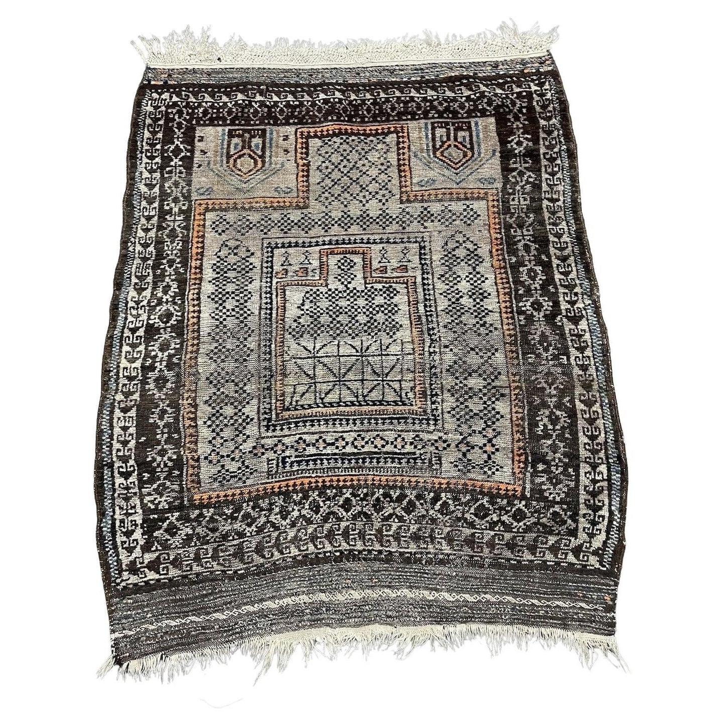 Antique Afghan Baluč rug with rust red and indigo medallions