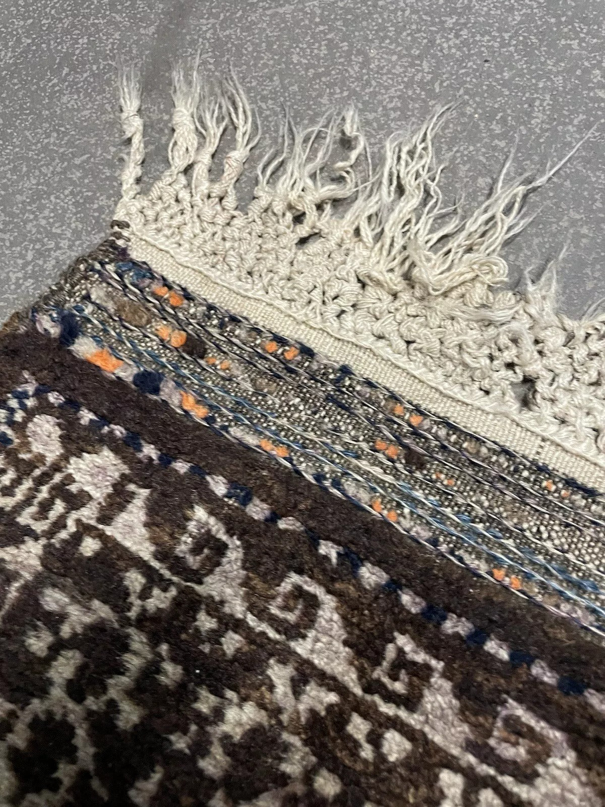 Hand-knotted tribal rug with ivory and brown highlights
