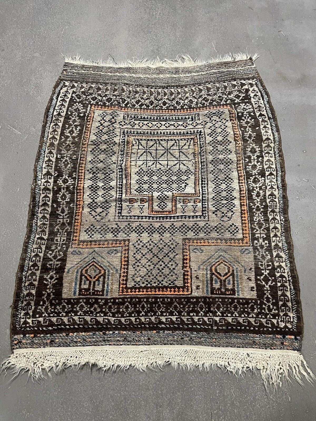 Indigo accents in tribal carpet of Afghan origin
