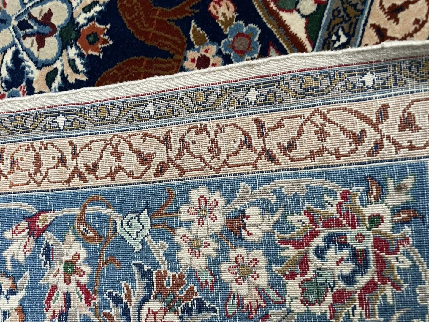 Hand-knotted wool pile detail on Persian rug