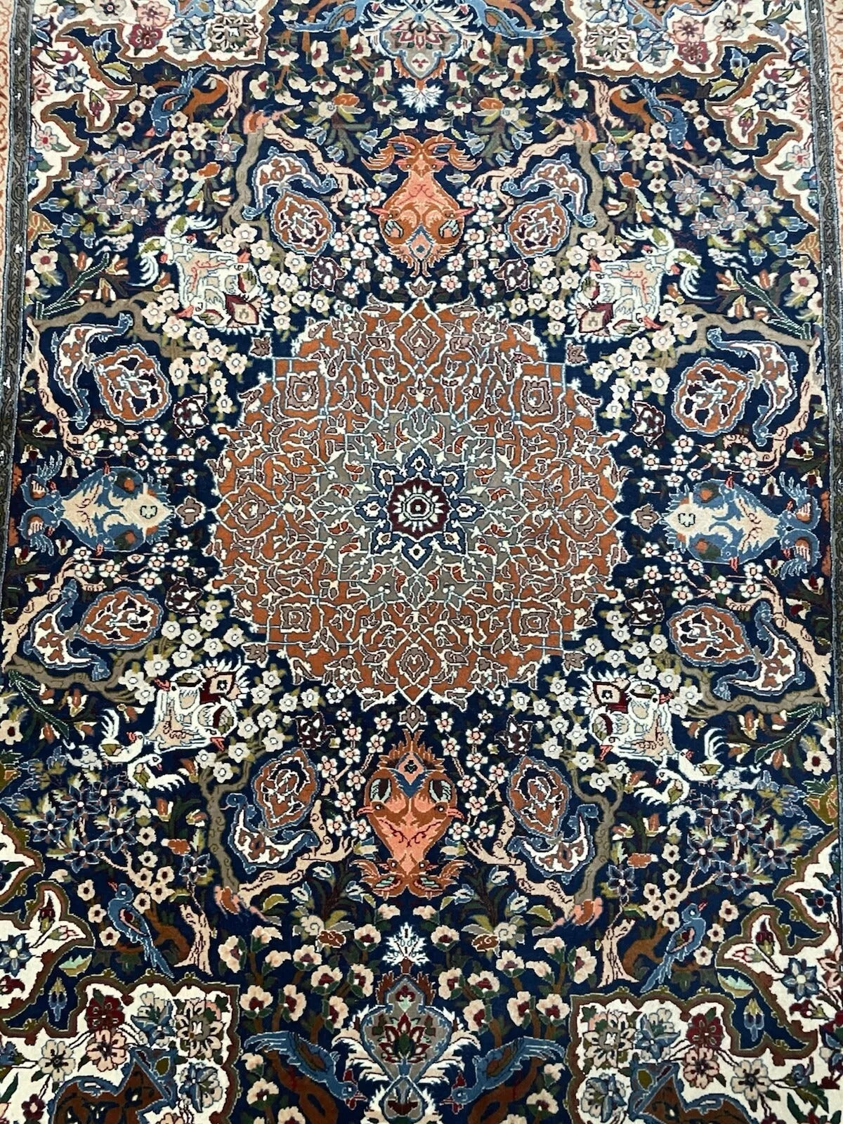 Silk highlights in intricate Persian rug weave
