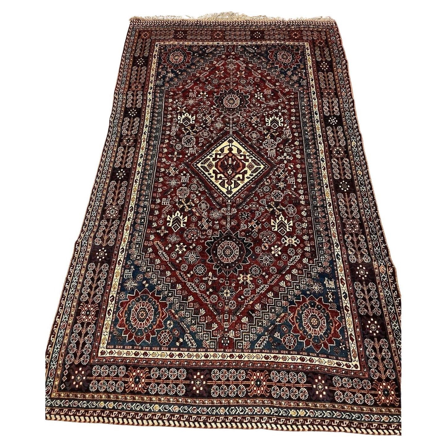 Antique Persian Gashkai rug with bold medallion design