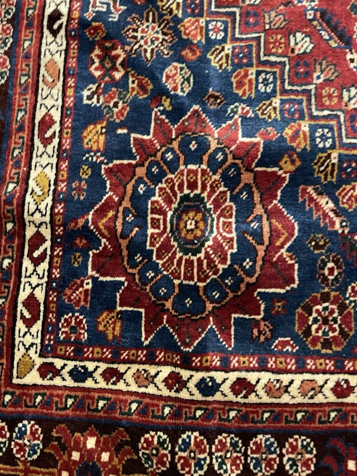 Detailed geometric and symbolic motifs on rug